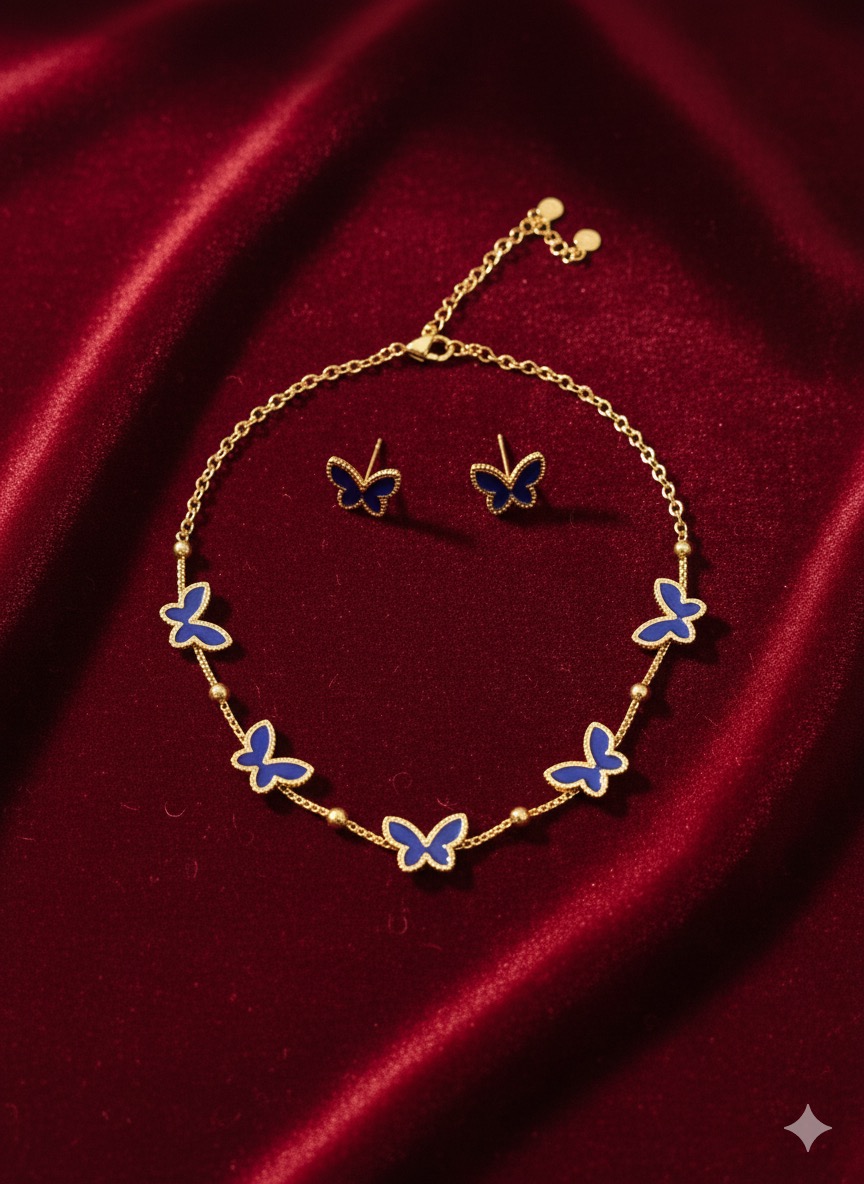 gold-tone chain necklace featuring multiple royal blue butterfly motifs.